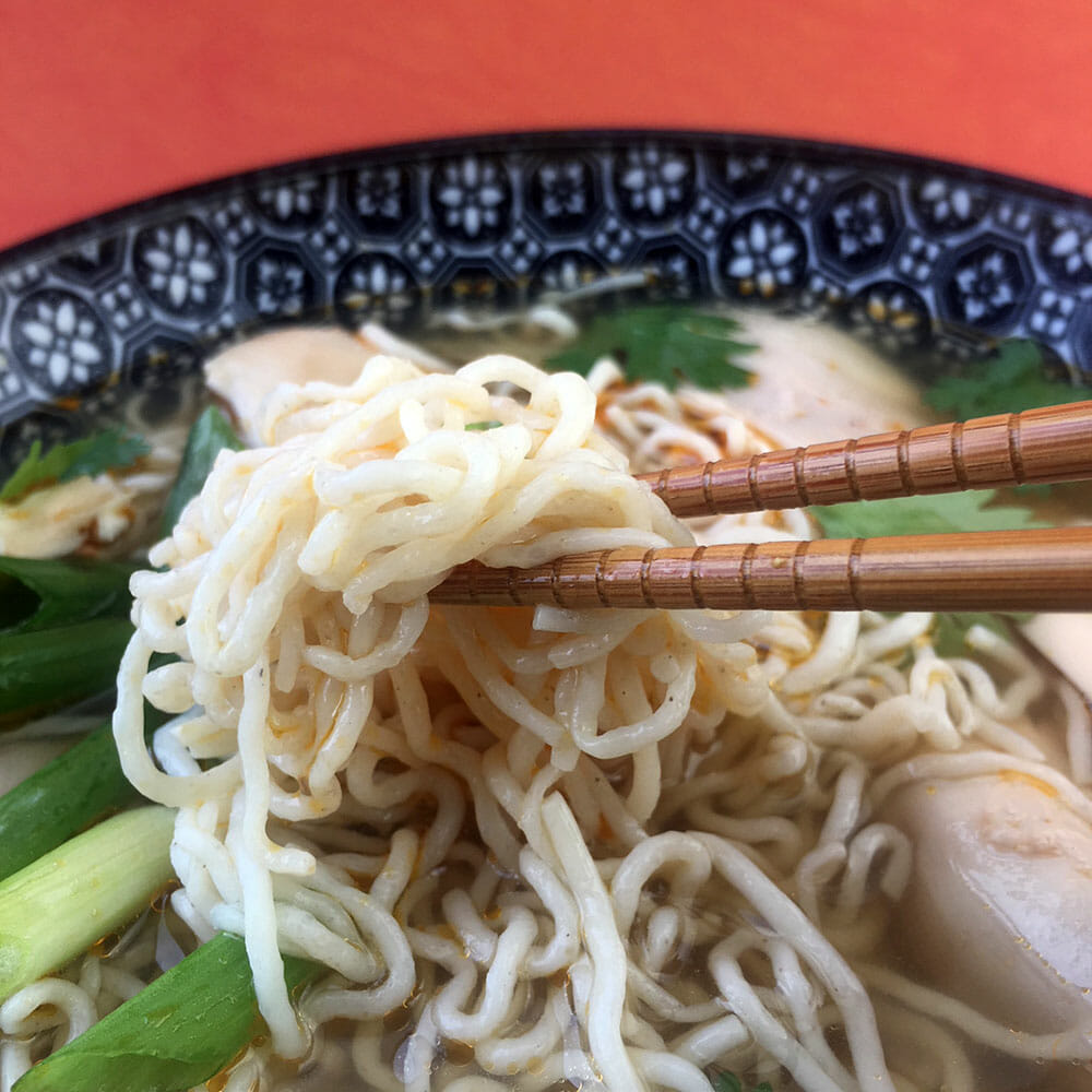 a bowl of Keto Chicken Ramen Soup with Shirataki Noodles